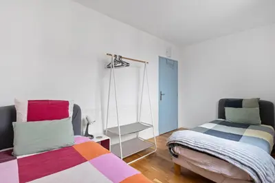 Un ou plusieurs lits dans un hébergement de l'établissement Cosy in Paris
