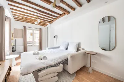 Un ou plusieurs lits dans un hébergement de l'établissement Montparnasse - Studio Fully equipped