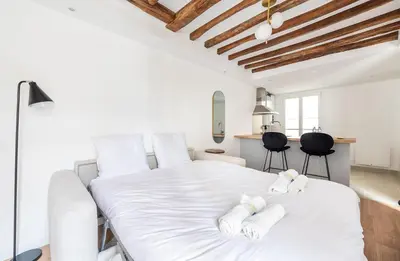 Un ou plusieurs lits dans un hébergement de l'établissement Montparnasse - Studio Fully equipped