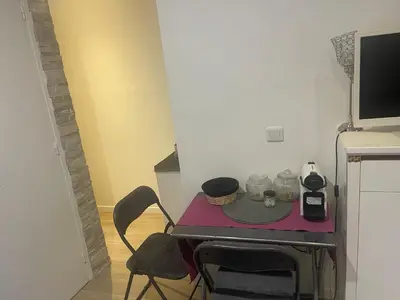 Télévision ou salle de divertissement dans l'établissement Le cocon