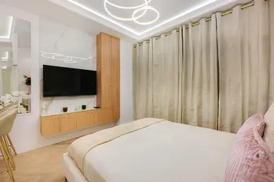 Télévision ou salle de divertissement dans l'établissement Cœur du Marais
