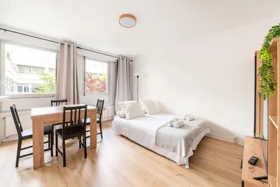 Un ou plusieurs lits dans un hébergement de l'établissement Montparnasse & Studio & Downtown
