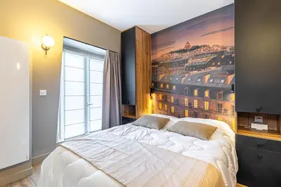 Un ou plusieurs lits dans un hébergement de l'établissement GuestReady - Nice urban hideout near Montmartre