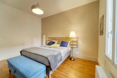 Un ou plusieurs lits dans un hébergement de l'établissement Residence Reine - Boulogne - Paris