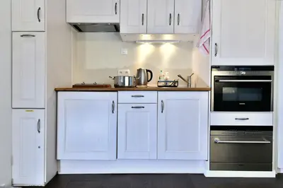Cuisine ou kitchenette dans l'établissement Romantic studio in center of Paris