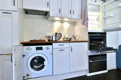 Cuisine ou kitchenette dans l'établissement Romantic studio in center of Paris