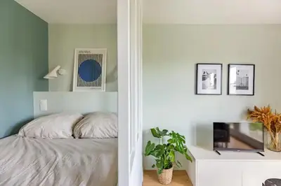 Un ou plusieurs lits dans un hébergement de l'établissement Charmant appartement calme proche de Paris
