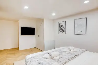 Un ou plusieurs lits dans un hébergement de l'établissement Bel appartement pour 6 personnes proche Champs Elysees
