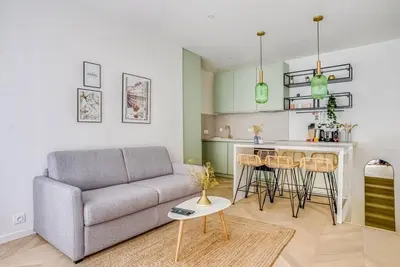 Coin salon dans l'établissement Bel appartement pour 6 personnes proche Champs Elysees
