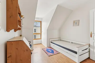 Un ou plusieurs lits dans un hébergement de l'établissement Appartement duplex dans le Saint Lambert by Weekome