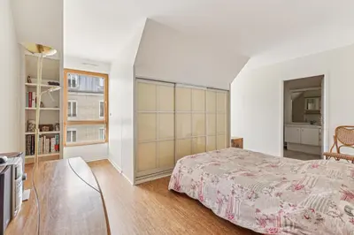 Un ou plusieurs lits dans un hébergement de l'établissement Appartement duplex dans le Saint Lambert by Weekome