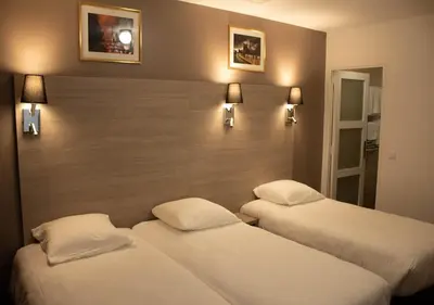 Un ou plusieurs lits dans un hébergement de l'établissement Paris Rooms & Dreams Hotel