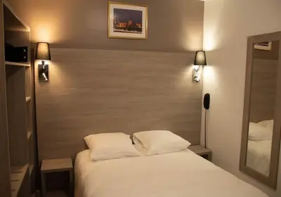 Un ou plusieurs lits dans un hébergement de l'établissement Paris Rooms & Dreams Hotel