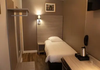Un ou plusieurs lits dans un hébergement de l'établissement Paris Rooms & Dreams Hotel