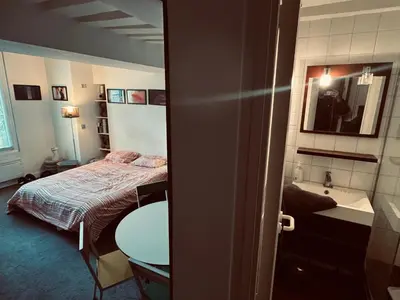 Un ou plusieurs lits dans un hébergement de l'établissement Suite indépendante studio top centre Marais