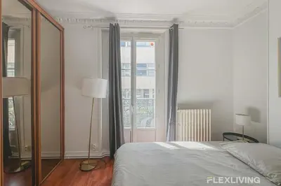 Un ou plusieurs lits dans un hébergement de l'établissement Flexliving - room - Lindet