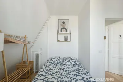 Un ou plusieurs lits dans un hébergement de l'établissement Flexliving - room - Houel
