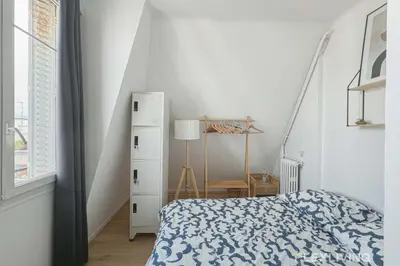 Un ou plusieurs lits dans un hébergement de l'établissement Flexliving - room - Houel