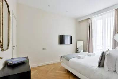 Un ou plusieurs lits dans un hébergement de l'établissement Family Retreat - Le Marais - with AC