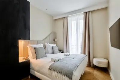 Un ou plusieurs lits dans un hébergement de l'établissement Family Retreat - Le Marais - with AC