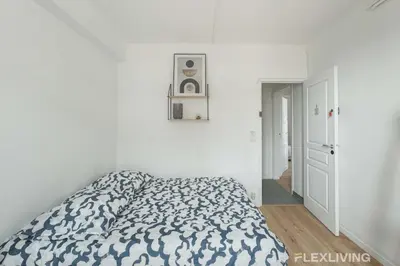 Un ou plusieurs lits dans un hébergement de l'établissement Flexliving - room - Houel