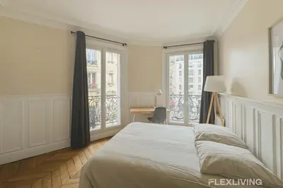 Un ou plusieurs lits dans un hébergement de l'établissement Flexliving - Room - Lamarck