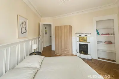 Un ou plusieurs lits dans un hébergement de l'établissement Flexliving - Room - Lamarck