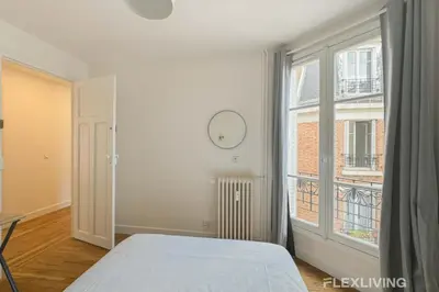 Un ou plusieurs lits dans un hébergement de l'établissement Flexliving - whole apartment - Abbé Groult