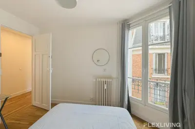 Un ou plusieurs lits dans un hébergement de l'établissement Flexliving - whole apartment - Abbé Groult