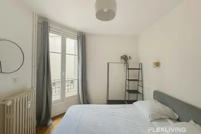 Un ou plusieurs lits dans un hébergement de l'établissement Flexliving - whole apartment - Abbé Groult