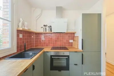 Cuisine ou kitchenette dans l'établissement Flexliving - whole apartment - Abbé Groult