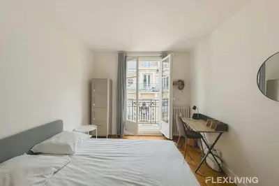 Un ou plusieurs lits dans un hébergement de l'établissement Flexliving - room - Abbé Groult