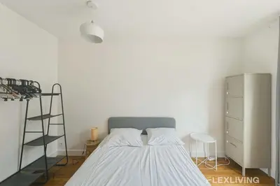 Un ou plusieurs lits dans un hébergement de l'établissement Flexliving - room - Abbé Groult