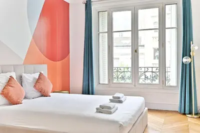 Un ou plusieurs lits dans un hébergement de l'établissement Appartement Haussmannien lumineux et central