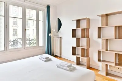 Un ou plusieurs lits dans un hébergement de l'établissement Appartement Haussmannien lumineux et central
