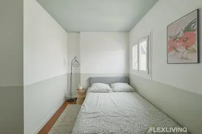 Un ou plusieurs lits dans un hébergement de l'établissement Flexliving - room - Losserand