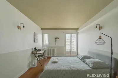 Un ou plusieurs lits dans un hébergement de l'établissement Flexliving - room - Losserand