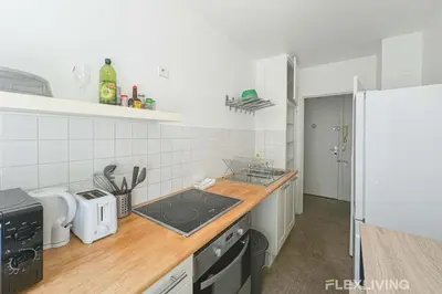 Cuisine ou kitchenette dans l'établissement Flexliving - Room - Friant