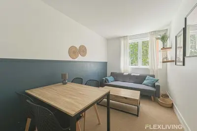 Coin salon dans l'établissement Flexliving - Room - Friant