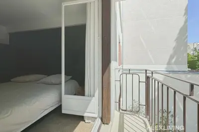 Un ou plusieurs lits dans un hébergement de l'établissement Flexliving - room - Friant