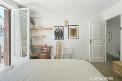 Un ou plusieurs lits dans un hébergement de l'établissement Flexliving - room - Friant