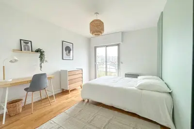 Un ou plusieurs lits dans un hébergement de l'établissement Flexliving - whole apartment - Hillairet