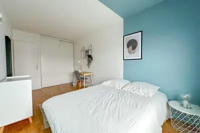 Un ou plusieurs lits dans un hébergement de l'établissement Flexliving - whole apartment - Hillairet