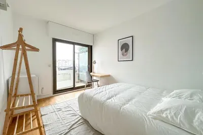 Un ou plusieurs lits dans un hébergement de l'établissement Flexliving - whole apartment - Hillairet