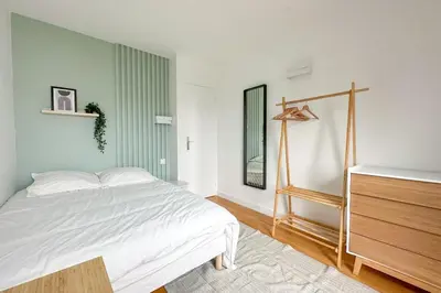 Un ou plusieurs lits dans un hébergement de l'établissement Flexliving - whole apartment - Hillairet