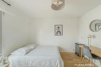Un ou plusieurs lits dans un hébergement de l'établissement Flexliving - studio - versailles