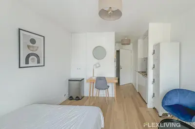 Un ou plusieurs lits dans un hébergement de l'établissement Flexliving - studio - versailles