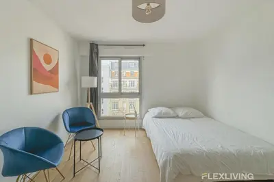 Un ou plusieurs lits dans un hébergement de l'établissement Flexliving - studio - versailles