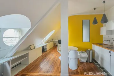 Coin salon dans l'établissement Flexliving - Onebedroom - Malesherbes - Eiffel Tower view