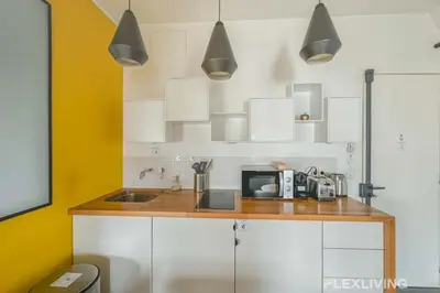 Cuisine ou kitchenette dans l'établissement Flexliving - Onebedroom - Malesherbes - Eiffel Tower view